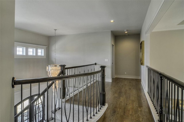 16904 Parkhill St, Overland Park, KS 66221 - corridor with an upstairs landing, wood finished floors, and recessed lighting