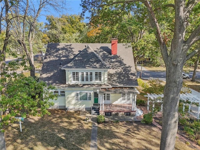 503 S 2nd St, Clinton, MO 64735 - rear view of property featuring a chimney and a shingled roof
