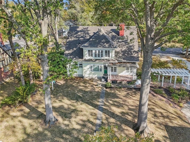 503 S 2nd St, Clinton, MO 64735 - view of front of house with a chimney, a deck, and roof with shingles