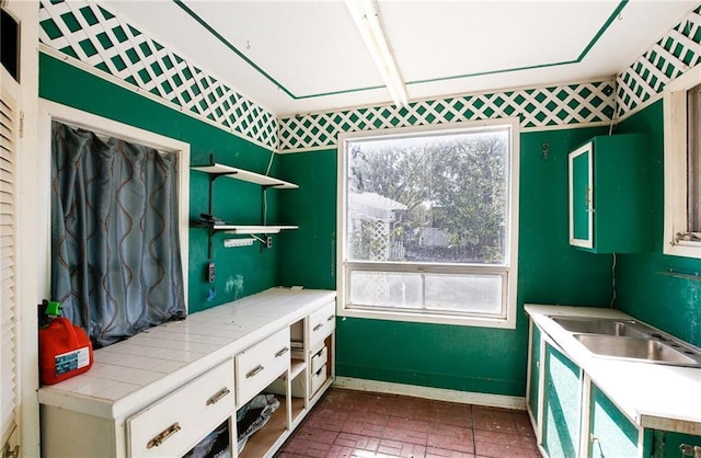 503 S 2nd St, Clinton, MO 64735 - mudroom featuring baseboards and brick patterned flooring