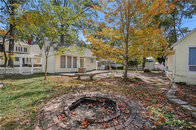 view of yard featuring a patio and a fire pit