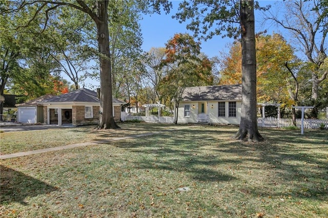 503 S 2nd St, Clinton, MO 64735 - view of yard with an attached garage and a pergola