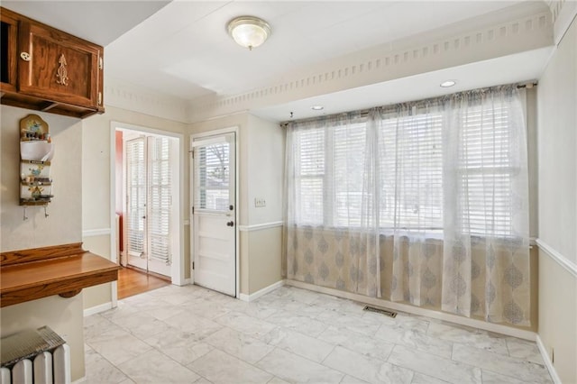 503 S 2nd St, Clinton, MO 64735 - entryway featuring light marble finish flooring and baseboards