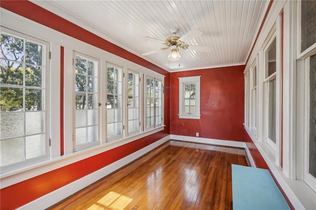 unfurnished sunroom featuring ceiling fan and wood ceiling