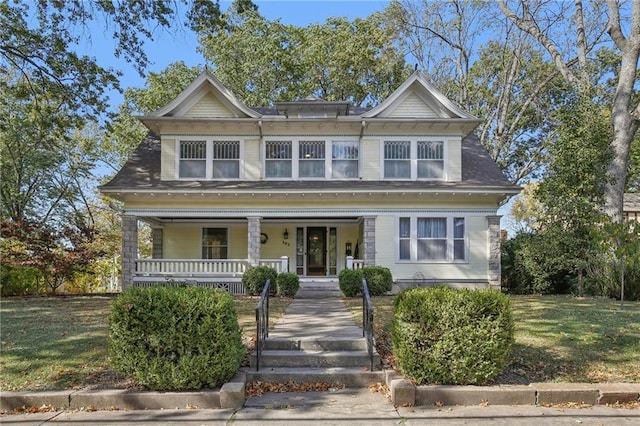 503 S 2nd St, Clinton, MO 64735 - view of front facade featuring covered porch and a front lawn