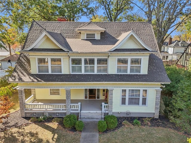 503 S 2nd St, Clinton, MO 64735 - victorian house with a chimney, covered porch, and a shingled roof