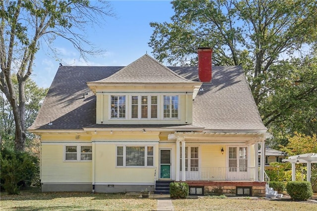 503 S 2nd St, Clinton, MO 64735 - back of property featuring a chimney, crawl space, covered porch, and a shingled roof