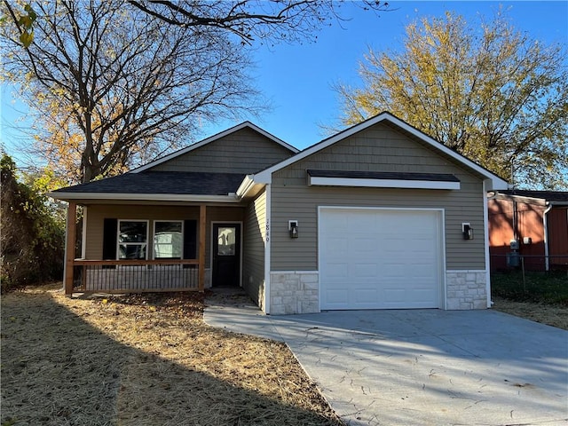 view of front of house with a garage and covered porch