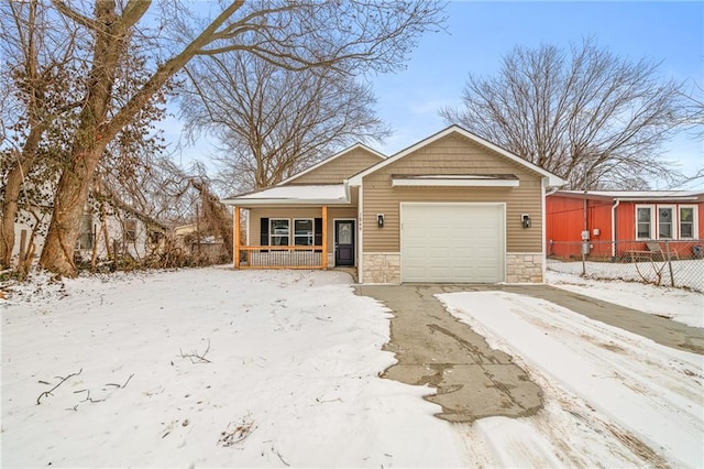 view of front of property with a garage and covered porch