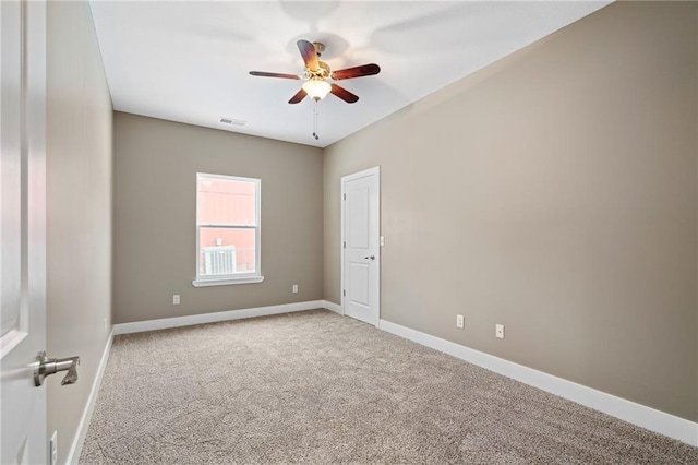 unfurnished room featuring ceiling fan and carpet floors