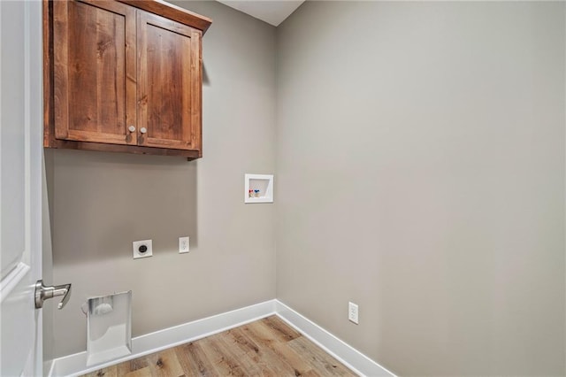 laundry room featuring cabinets, washer hookup, light hardwood / wood-style floors, and electric dryer hookup