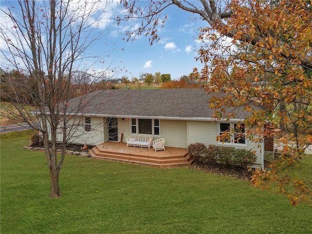 view of front of home featuring a wooden deck and a front lawn