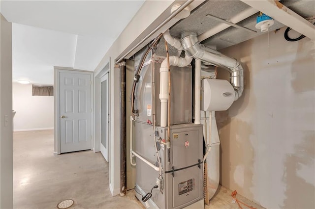 utility room featuring heating unit