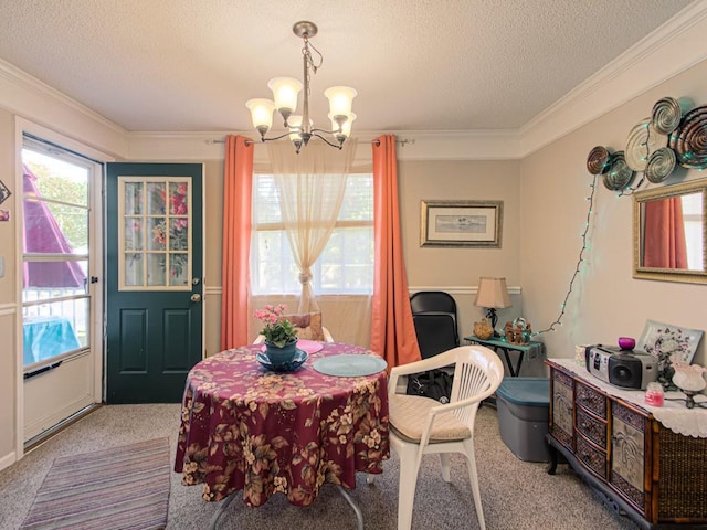 dining space featuring crown molding, carpet flooring, and a textured ceiling