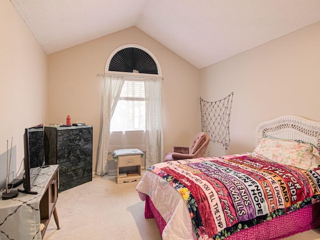 bedroom with light carpet and vaulted ceiling