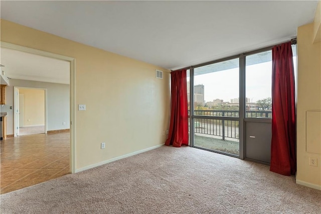 empty room featuring light carpet