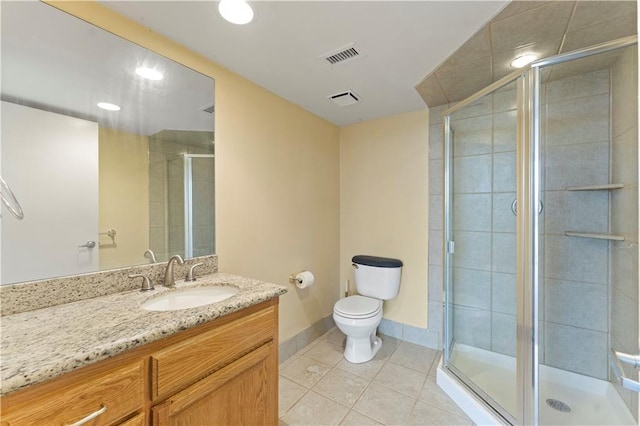 full bath featuring tile patterned floors, a shower stall, toilet, baseboards, and vanity