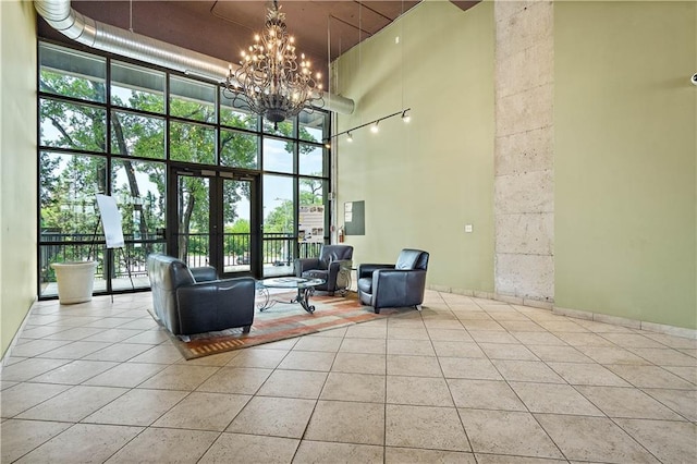 lobby with a high ceiling and a wall of windows