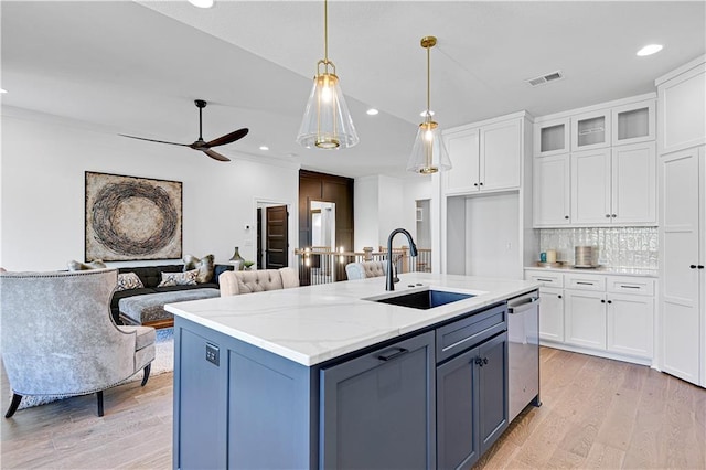 12967 S Constance St, Olathe, KS 66062 - kitchen with white cabinetry, dishwasher, light wood-style flooring, pendant lighting, and recessed lighting