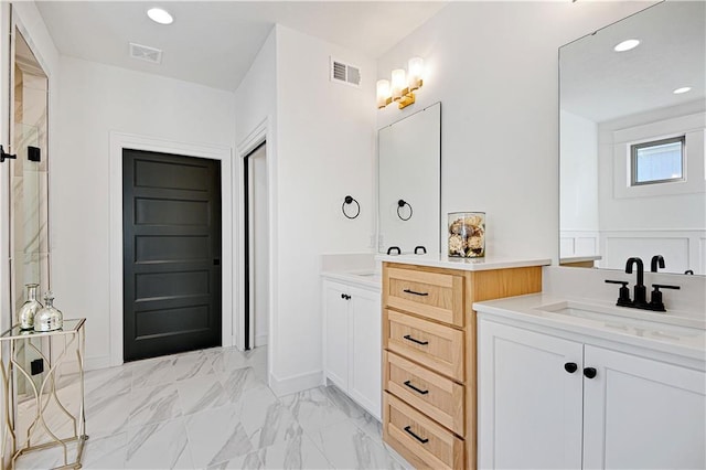 12967 S Constance St, Olathe, KS 66062 - bathroom with two vanities, a shower, recessed lighting, and marble look tiles
