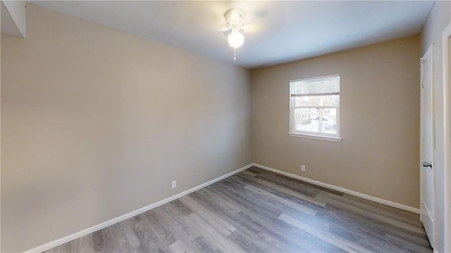 empty room with light wood-type flooring and ceiling fan