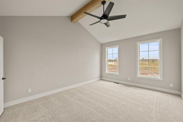 carpeted spare room with ceiling fan and baseboards