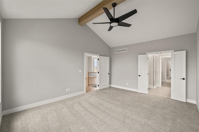 unfurnished bedroom with carpet flooring, beam ceiling, baseboards, high vaulted ceiling, and ceiling fan