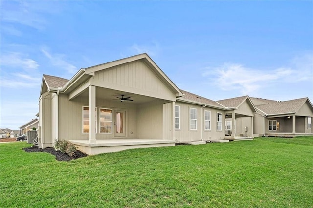 back of house featuring ceiling fan, a yard, and a patio