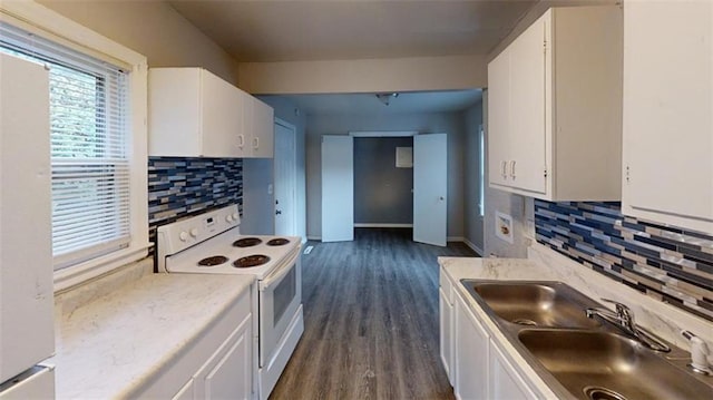 kitchen featuring white cabinets, white electric stove, and dark hardwood / wood-style floors