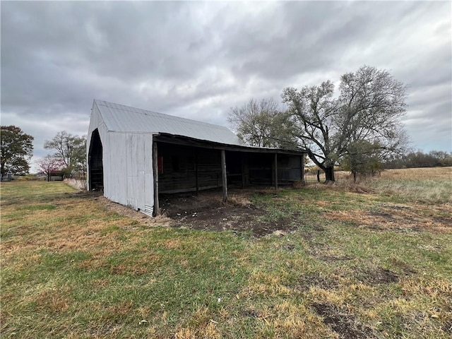 view of outbuilding with a lawn