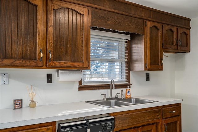 kitchen featuring dishwasher and sink