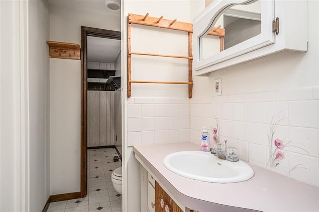 bathroom featuring vanity, toilet, tasteful backsplash, and tile patterned flooring