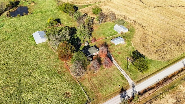 birds eye view of property with a rural view