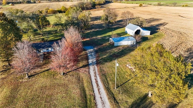 birds eye view of property with a rural view