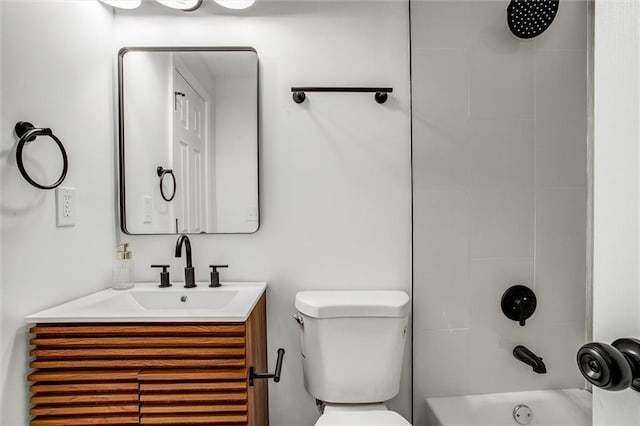 full bathroom with vanity, toilet, and tiled shower / bath