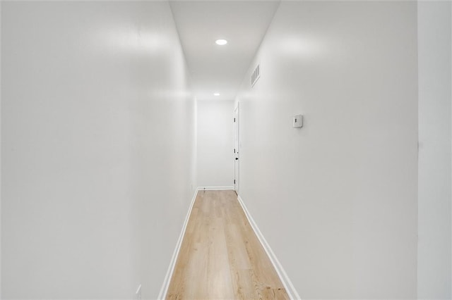 hallway with light wood-type flooring