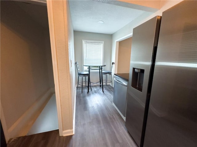 hall with hardwood / wood-style flooring