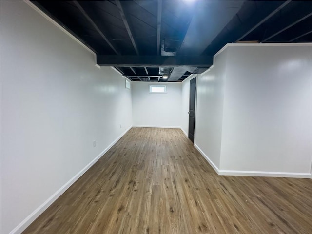 basement featuring wood-type flooring