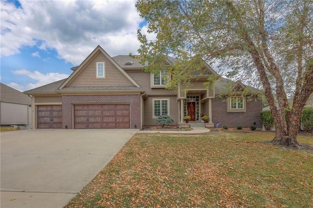 view of front of home with a garage and a front lawn