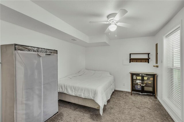 bedroom featuring french doors, carpet flooring, and ceiling fan