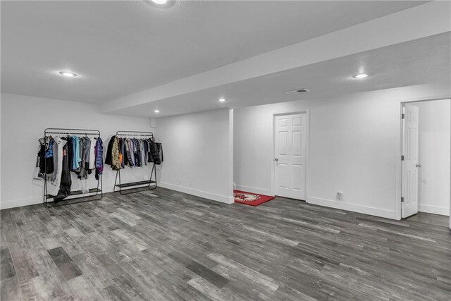 basement featuring hardwood / wood-style floors