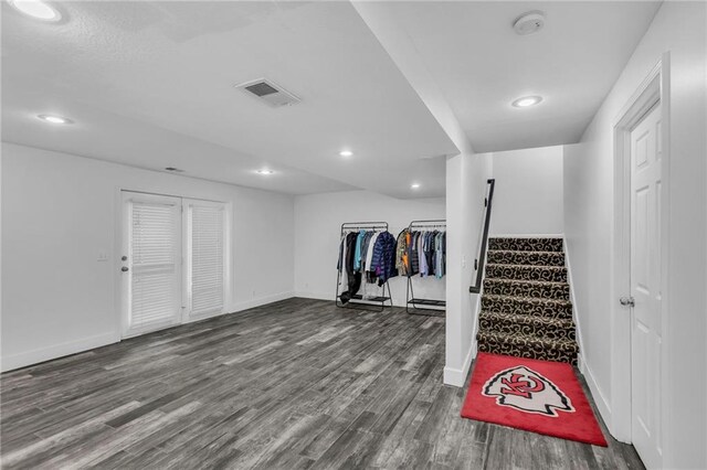 basement featuring hardwood / wood-style floors