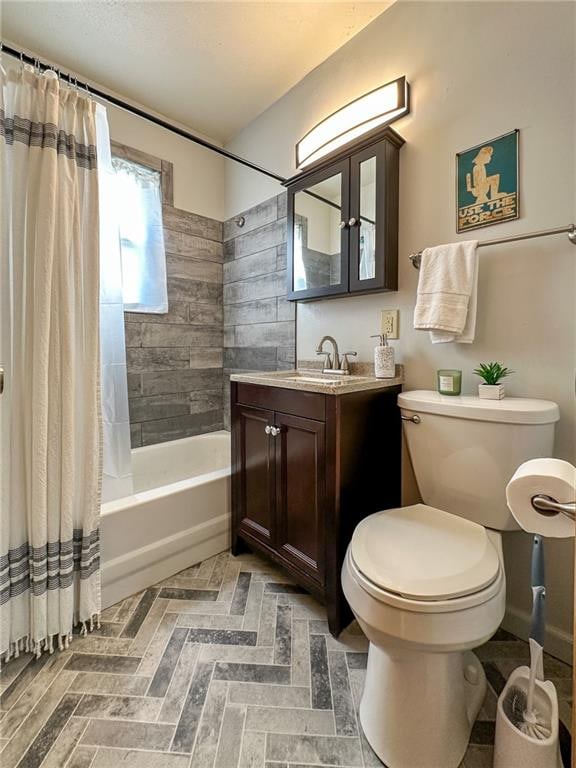 full bathroom featuring toilet, shower / tub combo with curtain, and vanity