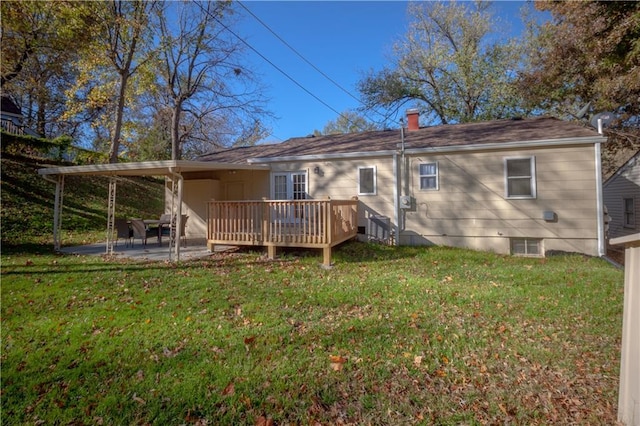 back of house featuring a patio, a deck, and a yard