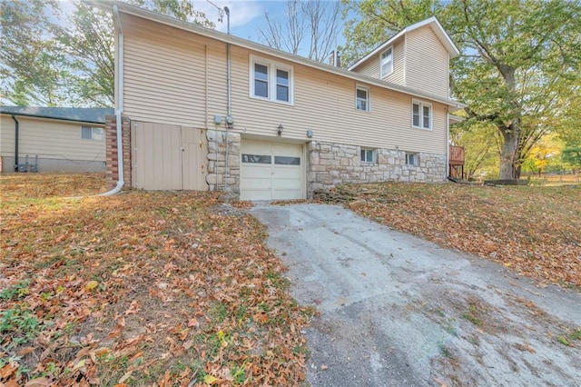 back of property featuring a garage