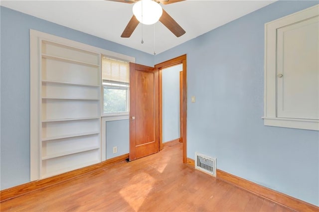 unfurnished bedroom featuring ceiling fan and light hardwood / wood-style floors