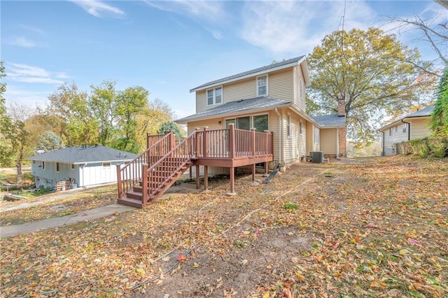 view of front of house with a deck and central air condition unit