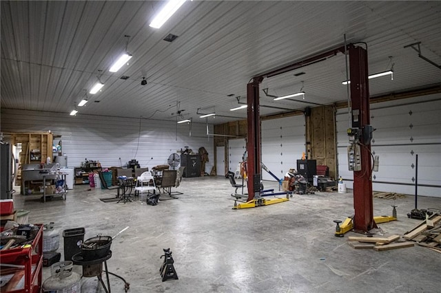 garage featuring wooden walls