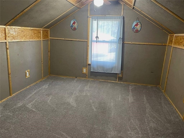 bonus room featuring ceiling fan, vaulted ceiling, and carpet floors