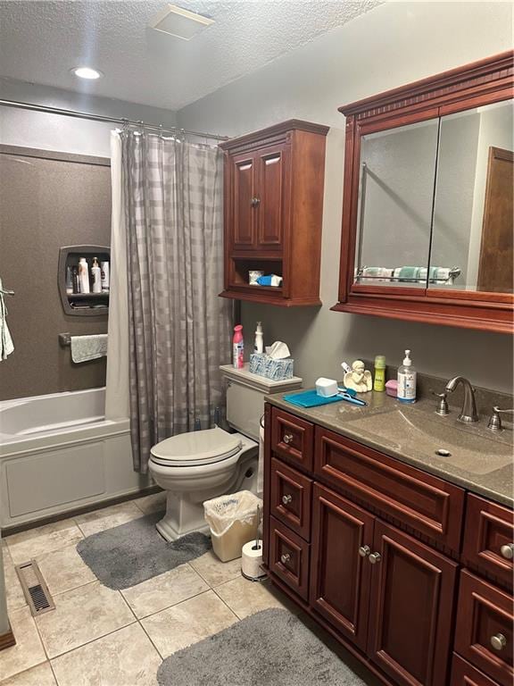 full bathroom featuring toilet, tile patterned floors, a textured ceiling, vanity, and shower / bath combination with curtain